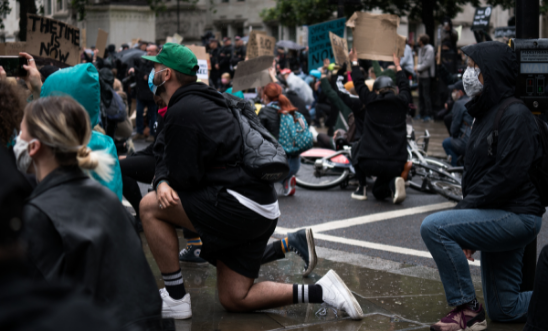 Black Lives Matters protests take the knee at BLM protests in London in the rain