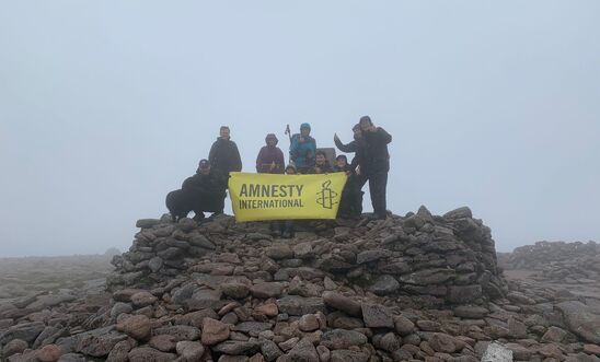 Jubilant banner raising at the Summit of Ben MacDui Jubilant banner raising at the Summit of Ben MacDui
