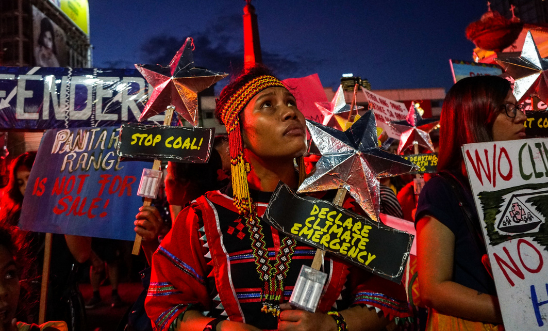 Philippine activists take part in a rally calling for action against climate change, in Manila on November 29, 2019.