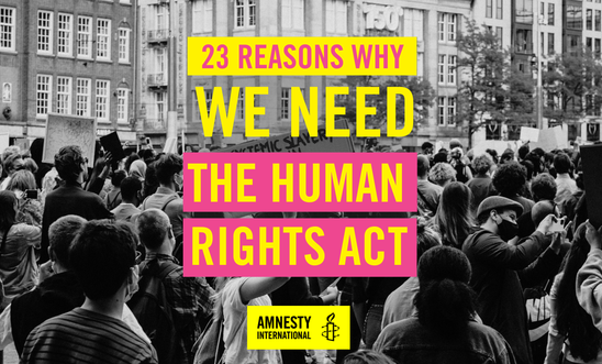 Image of protest that reads: 23 reasons why we need the Human Rights Act