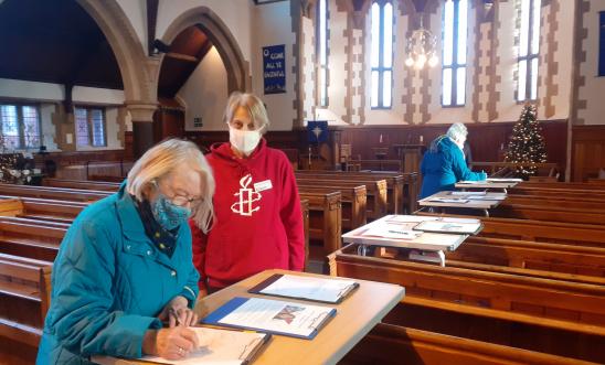 People signing letters