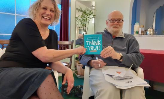 Bob and Kath sharing a thank you card