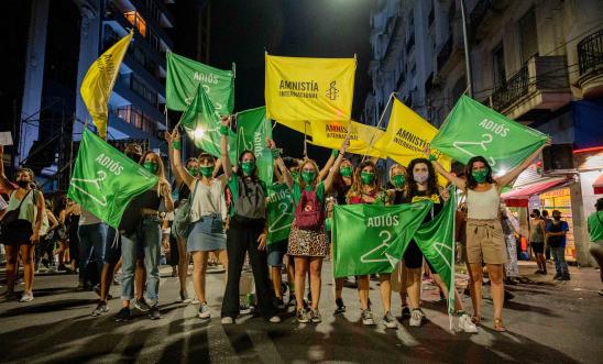 Image shows Amnesty activists in a protest for reproductive rights.