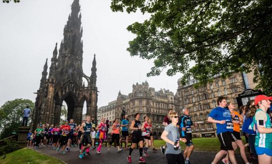 Image shows people running in Edinburgh.