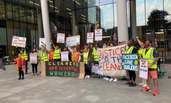 Guillermo and his former colleagues - all contracted cleaners - protest outside Meta's offices in London with placards