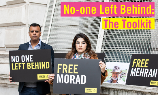 Morad Tahbaz's daughter, Roxanne, protests outside with Amnesty UK's CEO, Sacha, holding placards saying 'Free Morad' and 'No-one Left Behind'