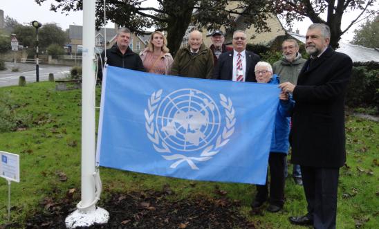 Preparing to hoist the United Nations flag