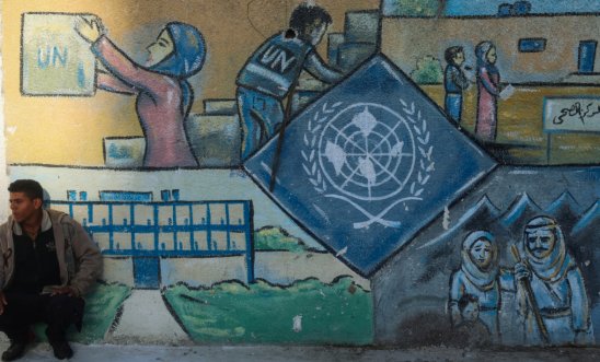 Street art with UNWRA logo in OPT Street art with UNWRA logo in OPT