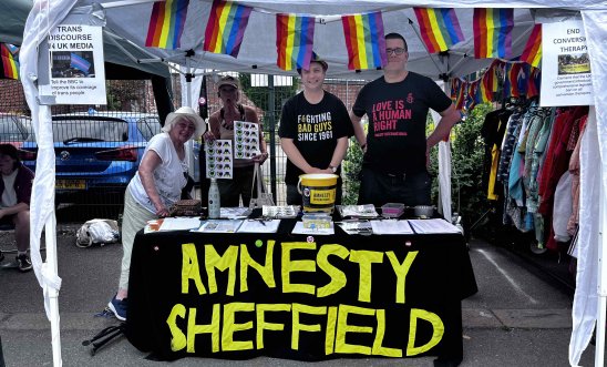 Members of Amnesty Sheffield standing underneath a gazebo at Kelham Pride festival in Sheffield. Members of Amnesty Sheffield standing underneath a gazebo at Kelham Pride festival in Sheffield.