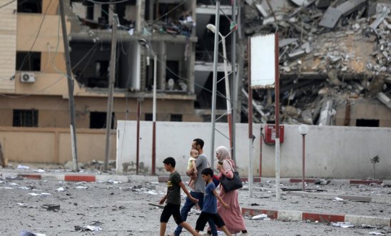 Family walking in the ruins of Gaza Family walking in the ruins of Gaza