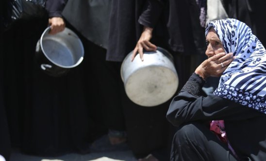 woman seeking aid in Gaza