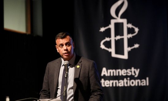 Sacha Deshmukh speaking at an Amnesty event Sacha Deshmukh speaking at an Amnesty event