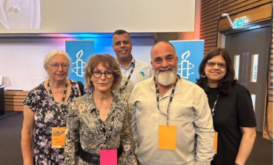An image showing group members alongside Agnès Callamard, Secretary General of Amnesty International,Sacha Deshmukh (AIUK CE) and Helen Horton (AIUK Section Board) An image showing group members alongside Agnès Callamard, Secretary General of Amnesty International,Sacha Deshmukh (AIUK CE) and Helen Horton (AIUK Section Board)