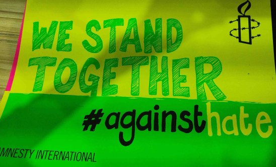 AIUK We Stand Together against hate placard AIUK We Stand Together against hate placard