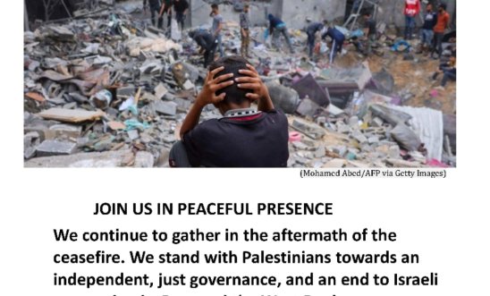 Gazan boy with his head in his hands sits amongst rubble 