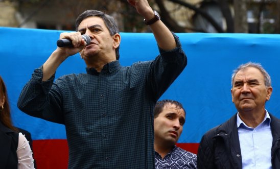 Ali Karimli speaking on stage