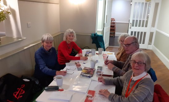 People writing letters