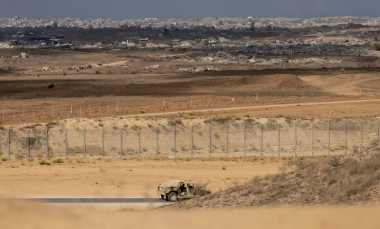 An Israeli army vehicle moves near the border with the Gaza Strip as seen from a position on the Israeli side of the border on October 29, 2025 in Southern Israel, Israel. 