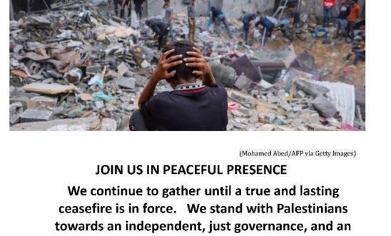 Boy with head in his hands sitting amongst rubble of destroyed buildings in Gaza aroun