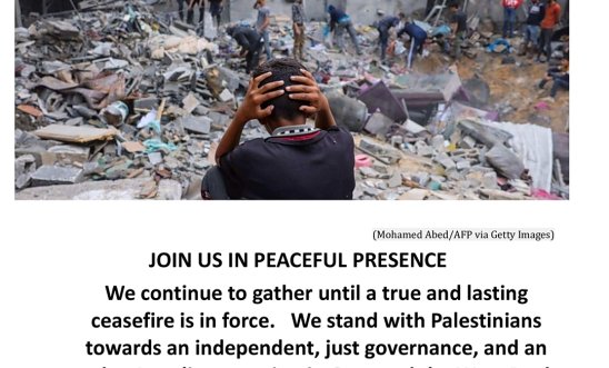 Boy with head in his hands sitting amongst rubble in Gaza