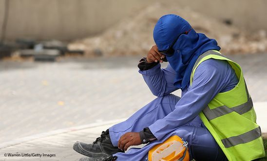 A construction worker takes a break from a building site in Doha, Qatar. 