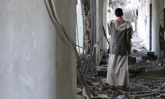 A man stands in rubble of destroyed building in Sa'ada. A man stands in rubble of destroyed building in Sa'ada.