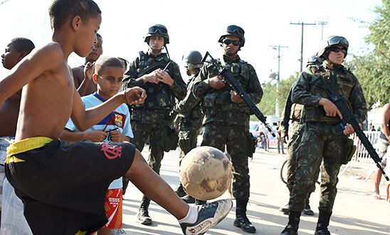 Brazilian soldiers provide security in the Mare favela in Rio de Janeiro, 2014. 