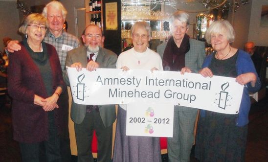 Photo of local AI members with the Minehead AI banner at the 10th birthday party Photo of local AI members with the Minehead AI banner at the 10th birthday party