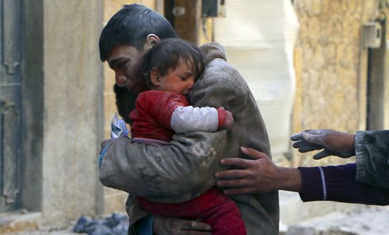 A boy holds his baby sister saved from rubble after an airstrike in Aleppo A boy holds his baby sister saved from rubble after an airstrike in Aleppo
