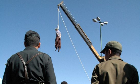 Iranian soldiers watch a man being hanged in Shiraz, south of Tehran, in 2007 Iranian soldiers watch a man being hanged in Shiraz, south of Tehran, in 2007