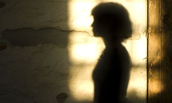 A stock image of a woman in silhouette