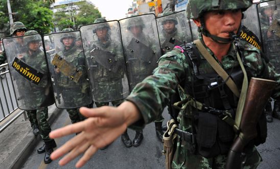 Thai army soldiers stand guard on a city centre street in Bangkok Thai army soldiers stand guard on a city centre street in Bangkok