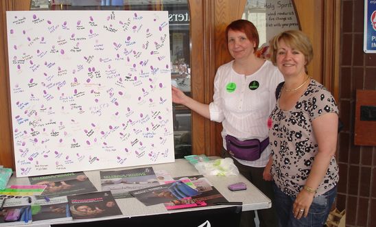 Picture of the board with 150 purple fingerprints and signatures