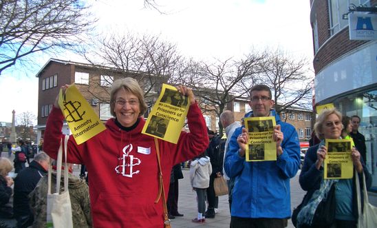 Amnesty members at a 'flash mob' action in Exeter Amnesty members at a 'flash mob' action in Exeter