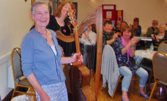 the musicians taking a bow at the folk music supper evening