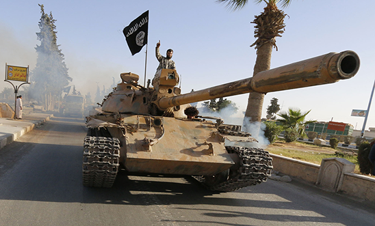 Islamic State (ISIS) hold a military parade along the streets of northern Raqqa 