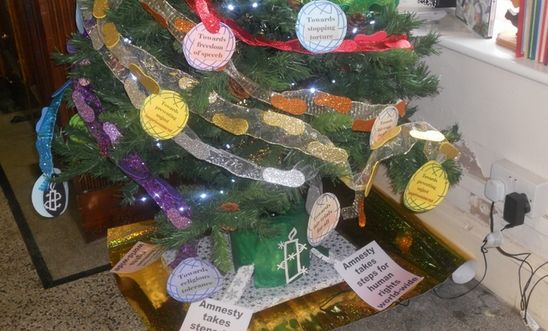 Tree with footprint decorations and AI slogans