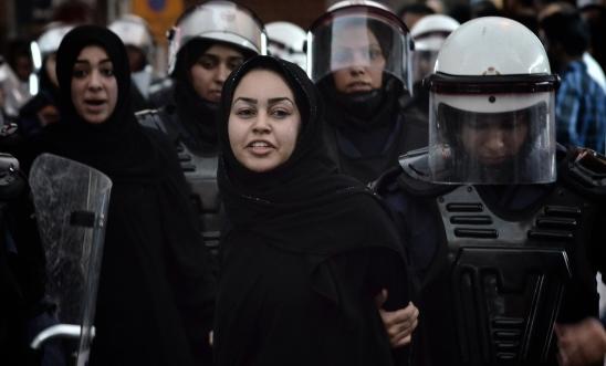 A Bahraini protester detained by riot police A Bahraini protester detained by riot police