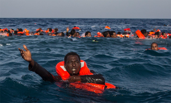 Refugees and migrants are seen swimming and yelling for assistance from crew members from the Migrant Offshore Aid Station (MOAS) 'Phoenix' vessel after a wooden boat bound for Italy carrying more than 500 people capsized on May 24, 2017 off Lampedusa, Italy. Refugees and migrants are seen swimming and yelling for assistance from crew members from the Migrant Offshore Aid Station (MOAS) 'Phoenix' vessel after a wooden boat bound for Italy carrying more than 500 people capsized on May 24, 2017 off Lampedusa, Italy.