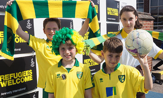 Pupils from Avenue Junior School, Norwich, wearing Norwich City colours Pupils from Avenue Junior School, Norwich, wearing Norwich City colours
