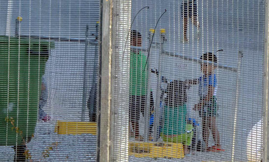 Children playing near the Refugee Processing Centre on Nauru Children playing near the Refugee Processing Centre on Nauru