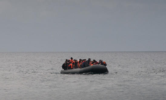 Refugees arriving by boat to Lesvos, Greece, from Turkey. Refugees arriving by boat to Lesvos, Greece, from Turkey.