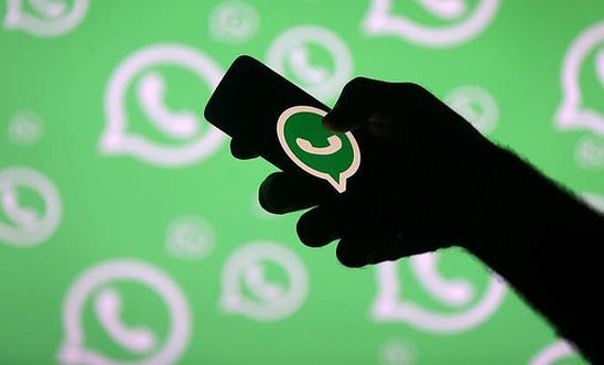 Mobile phone showing WhatsApp application Mobile phone showing WhatsApp application