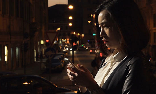 Scared woman looking at her phone Scared woman looking at her phone