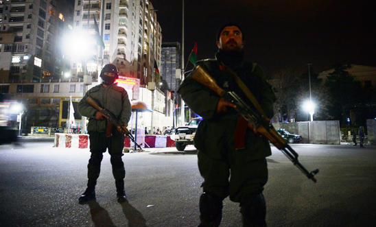 Afghan policemen stand guard in front of the Serena Hotel in Kabul on March 21 Afghan policemen stand guard in front of the Serena Hotel in Kabul on March 21