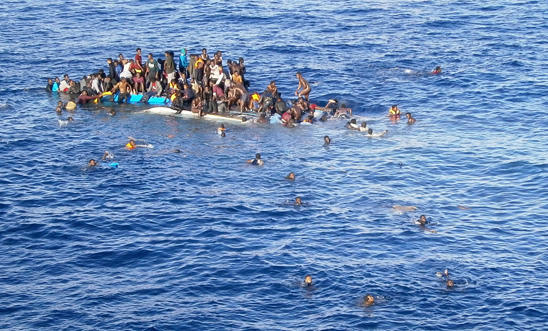An overloaded boat in the Mediterranean An overloaded boat in the Mediterranean