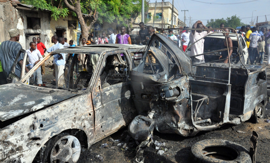 Burnt vehicles after a bomb attack in Maiduguri Burnt vehicles after a bomb attack in Maiduguri