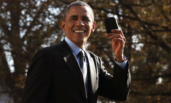 President Barack Obama holds up his Blackberry President Barack Obama holds up his Blackberry