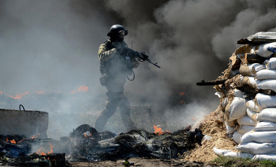 A member of the Ukrainian special forces at an abandoned roadblock in Slavyansk A member of the Ukrainian special forces at an abandoned roadblock in Slavyansk