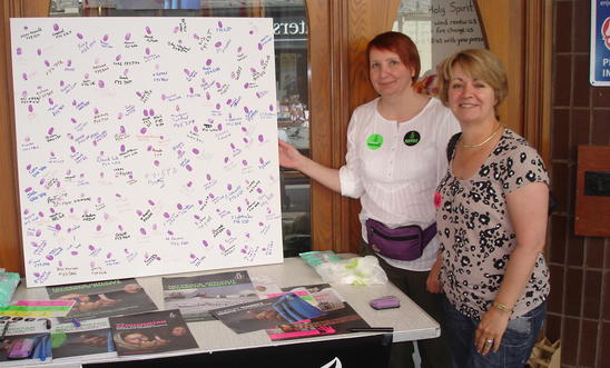 Picture of the board with 150 purple fingerprints and signatures Picture of the board with 150 purple fingerprints and signatures